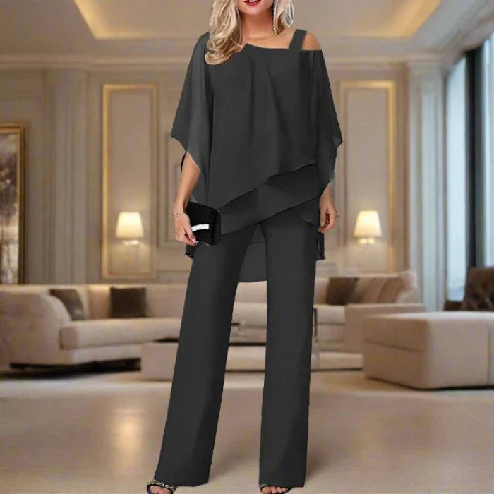 Elegante asymmetrische set met blouse en soepelvallende broek